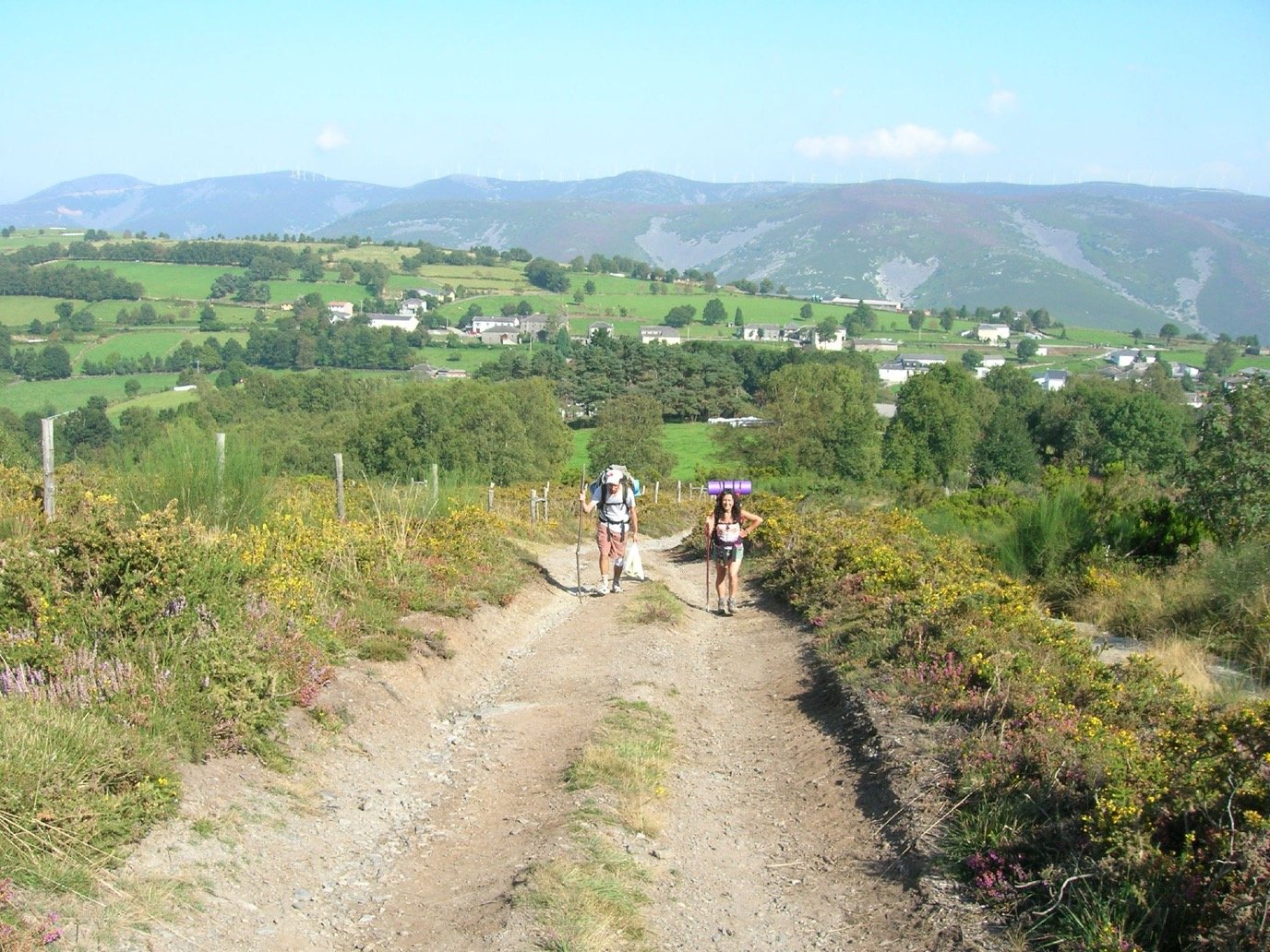Pilgrims on a ridge path of the Camino Primitivo near Berducedo, in the mountains of Asturias