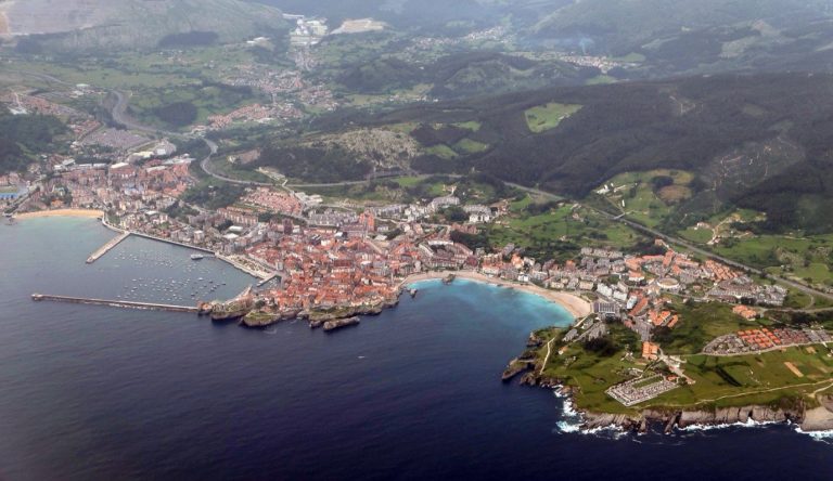 Aerial view of Castro Urdiales, its harbour, beach and headland