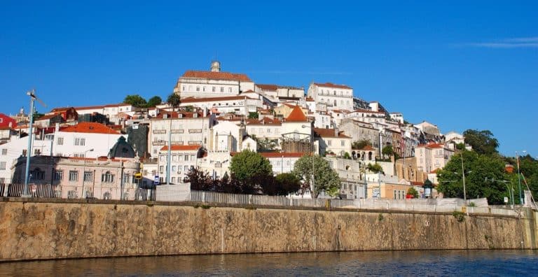 Coimbra and its university hill seen from the river Mondego