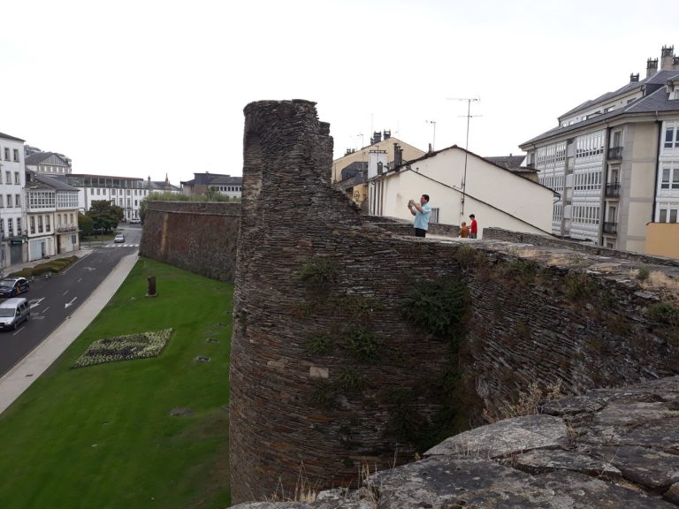The Roman walls of Lugo, one of their towers and the walkway on top