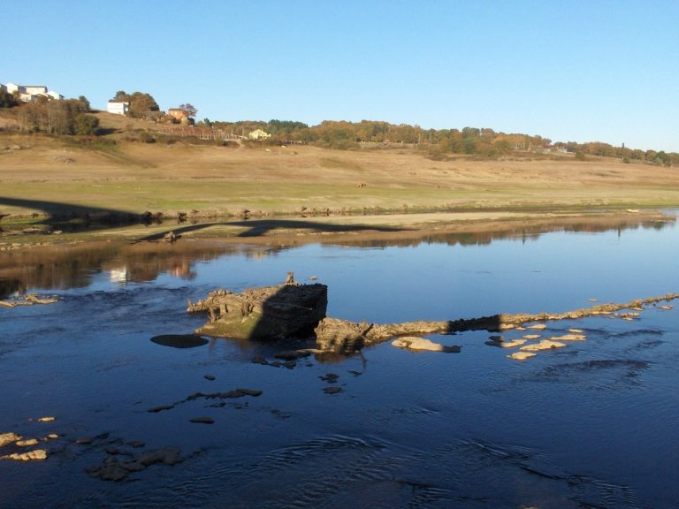 The river Miño at Portomarín, with the Belesar reservoir at low water